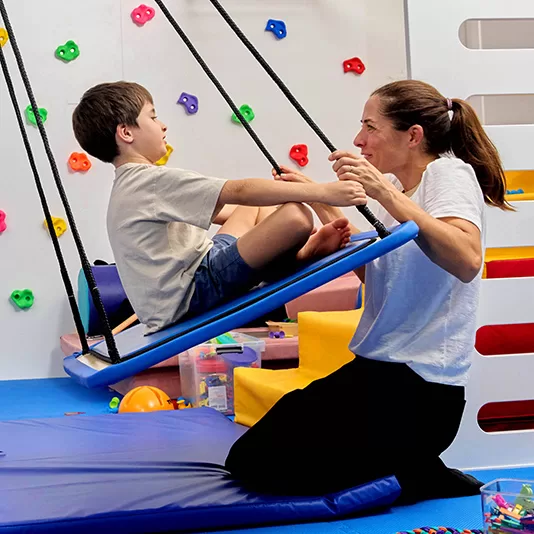 Therapist supporting children through play