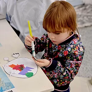 Therapist supporting children through play